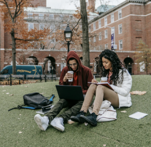 two students outdoors in a park setting